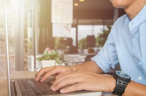 Man hand typing on a computer laptop keyboard. Business technology internet.. Stock Photos