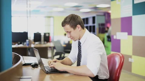 Man hand typing on keypad of his laptop. Man is working in office at computer. Stock Footage 65998025