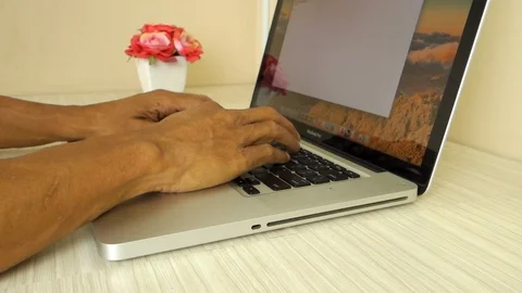 Man hand typing laptop on the table close up footage Stock Footage 113965163
