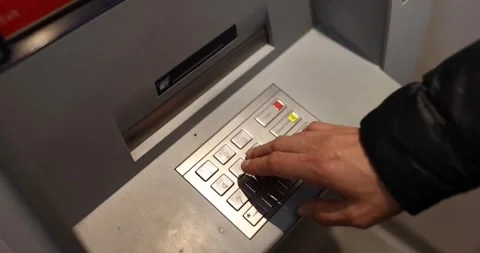 Man hand typing pin code on ATM keyboard closeup 4k movie slow motion Stock Footage 257411342
