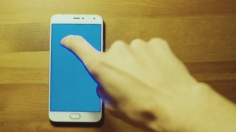 Man hand use blue chroma key smartphone and drop stack of dollar bills Stock Footage 72896236