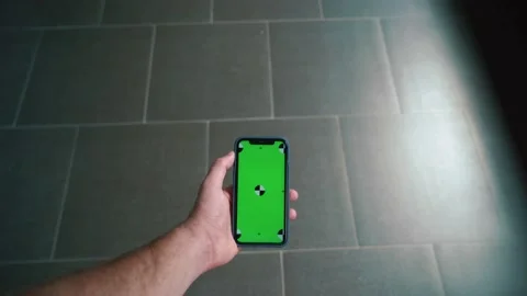 Man hand Use Green Screen Chroma Key Phone Point of View. tile background Stock Footage 229783091