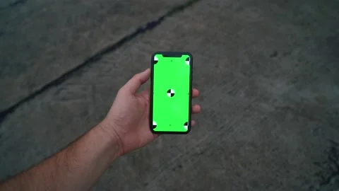 Man hand Use Green Screen Chroma Key Phone Point of View. tile background Stock Footage 229995171