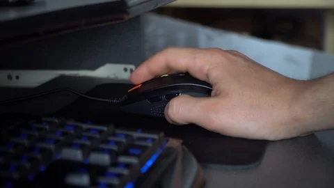 A man hand uses mouse. Guy arm clicks on the mouse buttons close up Stock Footage 126093156