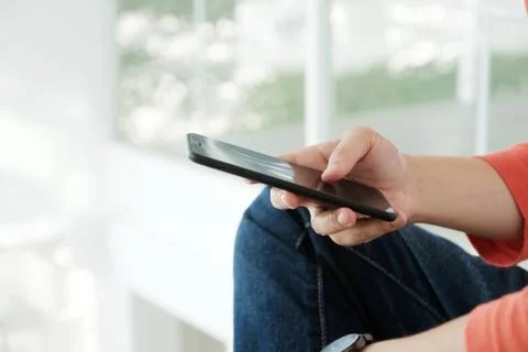 Man hand using black smart phone, people on phone, technology and lifestyle Stock Photos