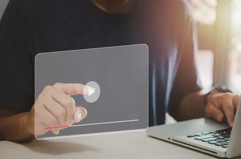 Man hand using computer laptop touch virtual search icon play video. modern I Stock Photos