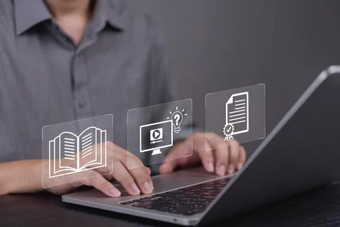 Man hand using laptop for e-learning, online education. Virtual interface i.. Fotos de archivo