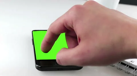 Man hand using a smart phone in the office near drink coffee with chroma key Video stock 62330934