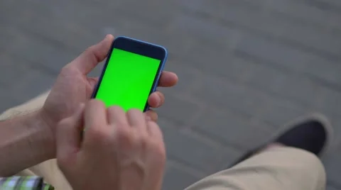 Man hand using smartphone with green screen Stock Footage 68213048