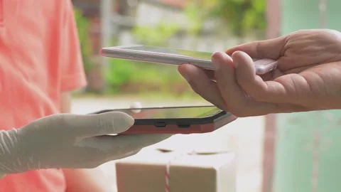 Man hand using smartphone to scan QR code payment for online goods fee. Stock Footage 154672058