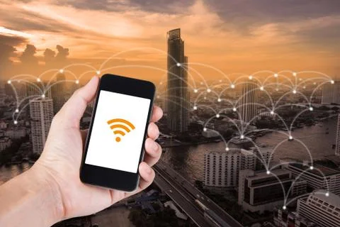 Man hand using smartphone searching data everything by wifi on top view citys Stock Photos