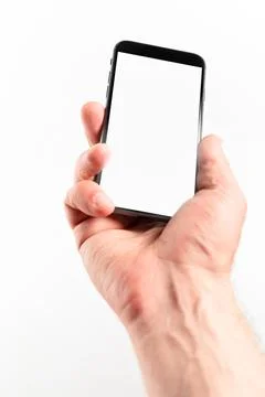Man hand using smartphone on white background. Closeup shot of man hand holdi Stock Photos