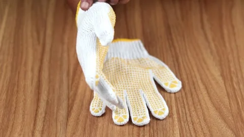 Man hand using using a pair work glove with fabric Stock Footage 309755302