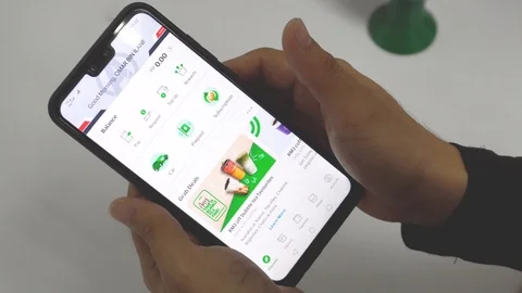 A man hand Using Waze App On Mobile for searching direction Video stock 106791576
