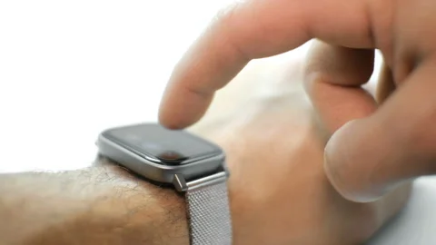 Man hand view while using smart watch on bright background,hi tech device Stock Footage 143597022