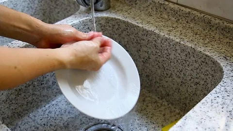 Man hand washing a dish Stock Footage 129175668
