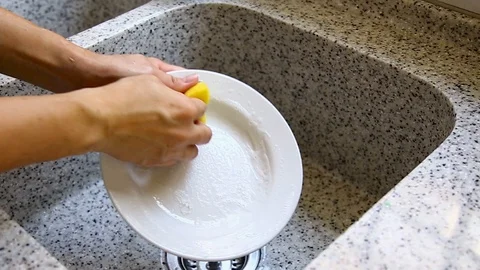 Man hand washing a dish Stock Footage 129175848