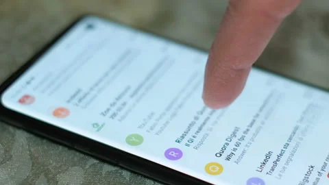 Man hand while using a smartphone google gmail app,email surfing,business news Stock Footage 148654466