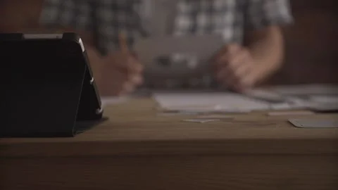 Man hand working attentively carefully concentrated on small detail of paper wor Stock Footage 138125636