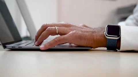 Man hand working on a notebook using touchpad and keyboard, close up. Slow .. Stock Footage 332670658