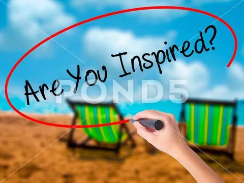 Man Hand writing Are You Inspired? with black marker on visual s Stock Photos