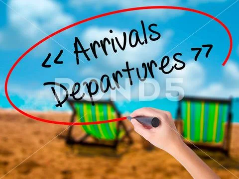 Man Hand writing Arrivals - Departures with black marker on visu Stock Photos