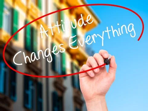 Man Hand writing Attitude Changes Everything with black marker on visual scre Stock Photos