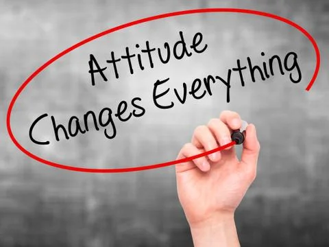 Man Hand writing Attitude Changes Everything with black marker on visual scre Stock Photos
