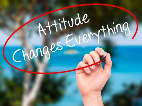 Man Hand writing Attitude Changes Everything with black marker on visual scre Stock Photos