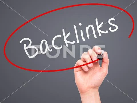 Man Hand writing Backlinks with marker on transparent wipe board Stock Photos