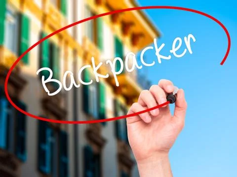 Man Hand writing Backpacker with black marker on visual screen. Stock Photos