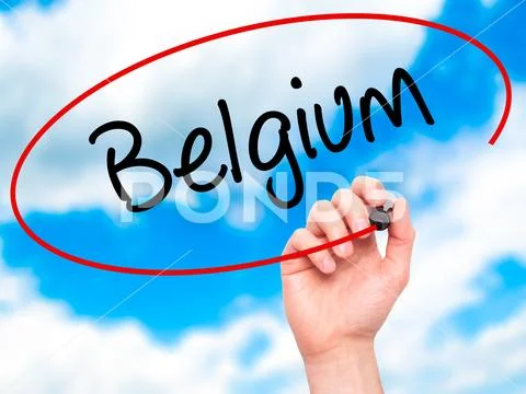 Man Hand writing Belgium with black marker on visual screen Stock Photos