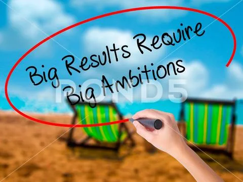 Man Hand writing Big Results Require Big Ambitions with black ma Stock Photos