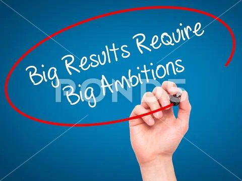 Man Hand writing Big Results Require Big Ambitions with black ma Stock Photos