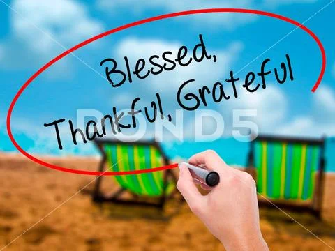 Man Hand writing Blessed Thankful Grateful with black marker on Stock Photos