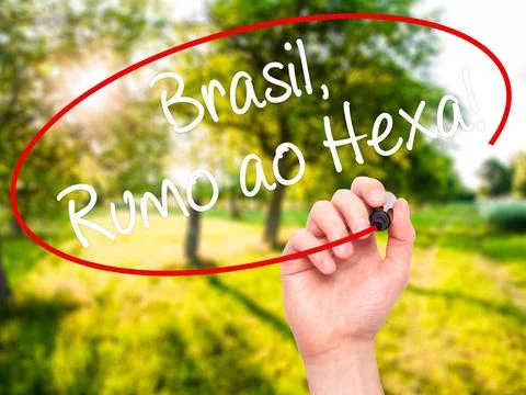 Man Hand writing Brasil, Rumo ao Hexa! with black marker on visual screen.... Stock Photos