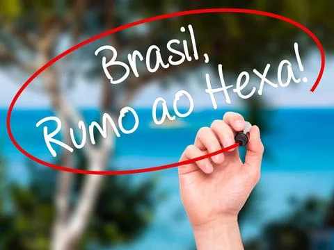 Man Hand writing Brasil, Rumo ao Hexa! with black marker on visual screen.... Stock Photos