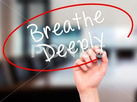 Man Hand writing Breathe Deeply with black marker on visual scre Stock Photos