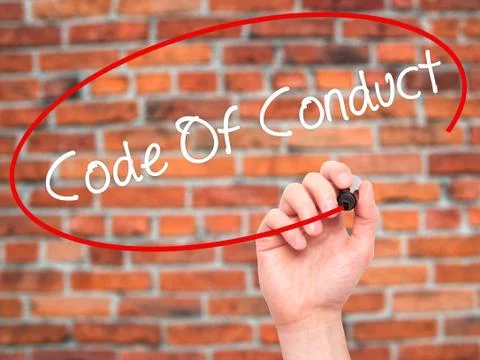 Man Hand writing Code Of Conduct with black marker on visual screen 写真素材