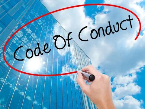 Man Hand writing Code Of Conduct with black marker on visual screen Stock Photos