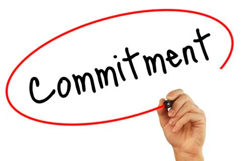 Man Hand writing Commitment with black marker on visual screen. Isolated on.. Stock-Fotos