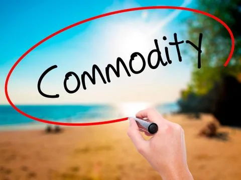 Man Hand writing Commodity with black marker on visual screen Stock Photos