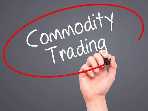 Man Hand writing Commodity Trading with black marker on visual screen. Man... Stock Photos