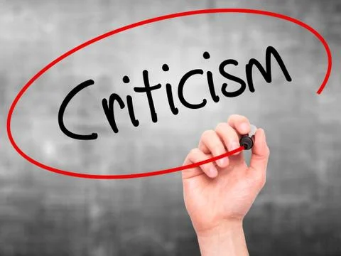 Man Hand writing Criticism with black marker on visual screen 스톡 사진
