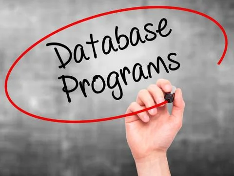 Man Hand writing Database Programs with black marker on visual screen. Foto stock