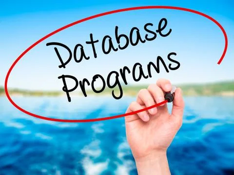 Man Hand writing Database Programs with black marker on visual screen. Foto stock