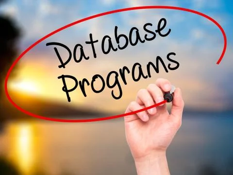 Man Hand writing Database Programs with black marker on visual screen. Foto stock