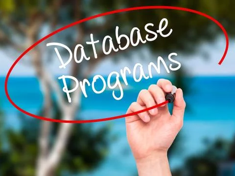 Man Hand writing Database Programs with black marker on visual screen. Foto stock
