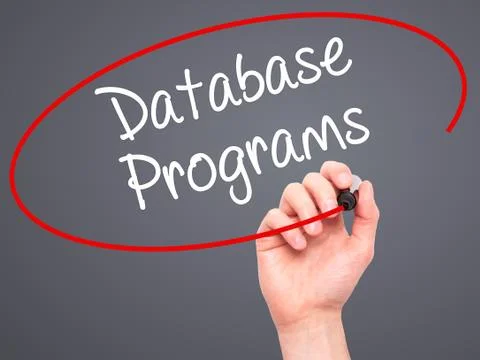 Man Hand writing Database Programs with black marker on visual screen. Foto stock