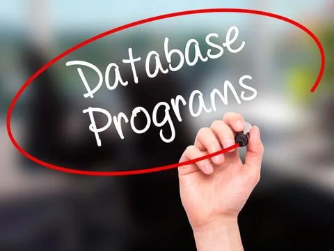 Man Hand writing Database Programs with black marker on visual screen. Foto stock